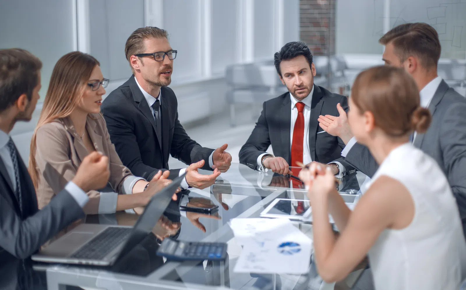 a group of people sitting around a table